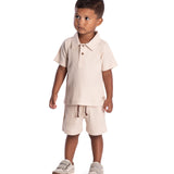 Conjunto infantil polo e bermuda malha canelada bege
