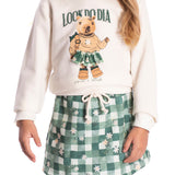 Conj. moletinho casaco off white capivara + shorts-saia estampado